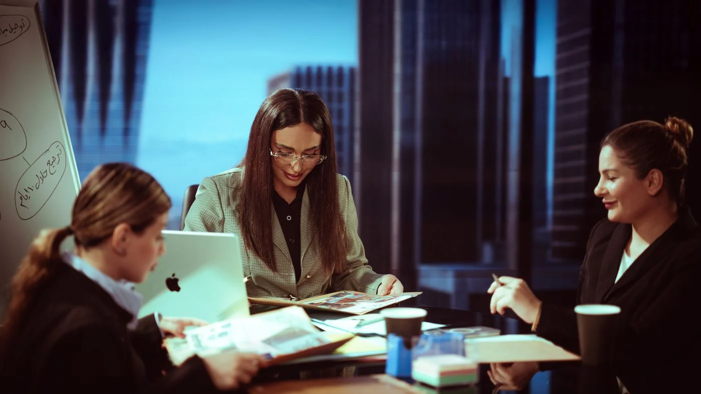 Illustrative scene of an Arab team discussing a plan in an office